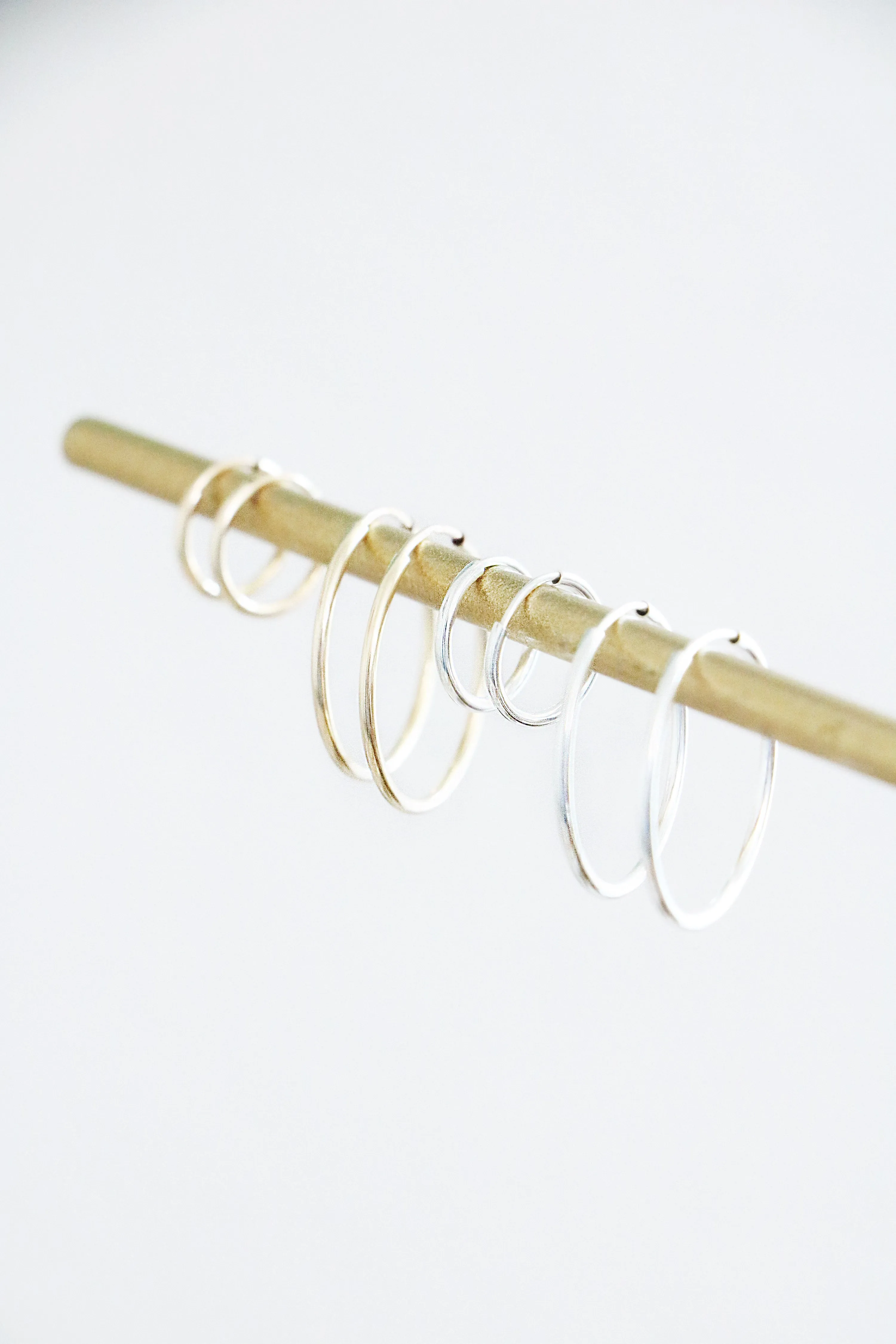 infinity hoop earrings { gold   silver }