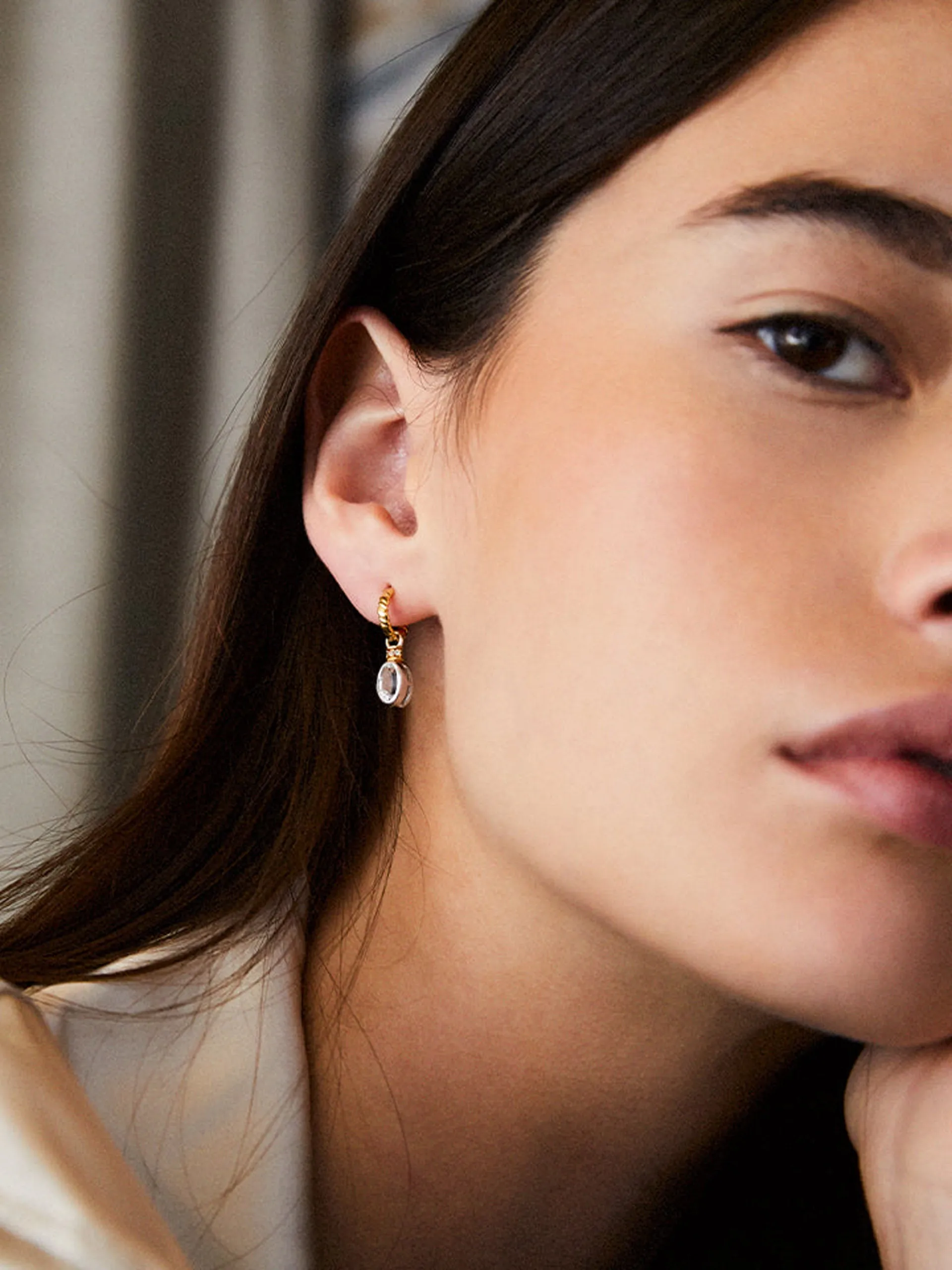 Oval cut charms on twisted hoops